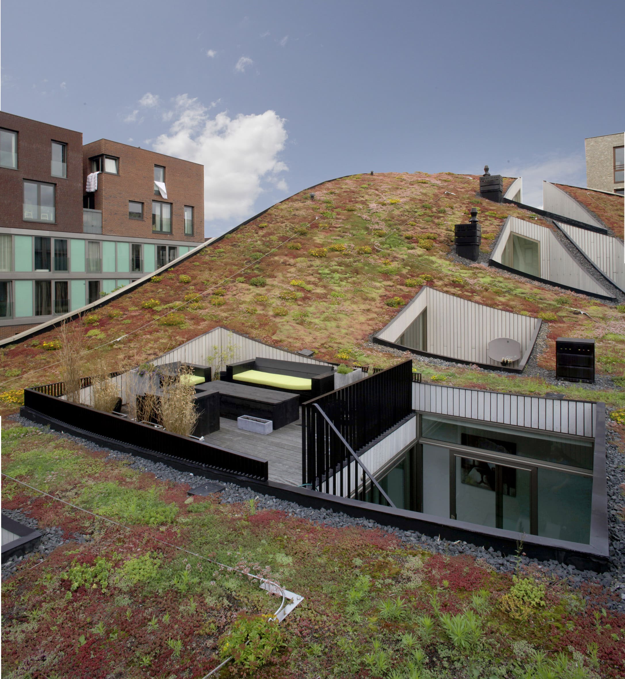Close view of the green roofscape at Blok K / Verdana, with planted roof surfaces and private terraces.